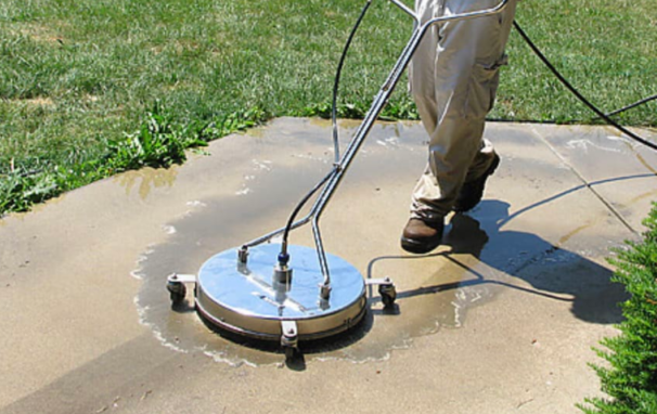 Power Pals cleaning concrete with a professional surface cleaner