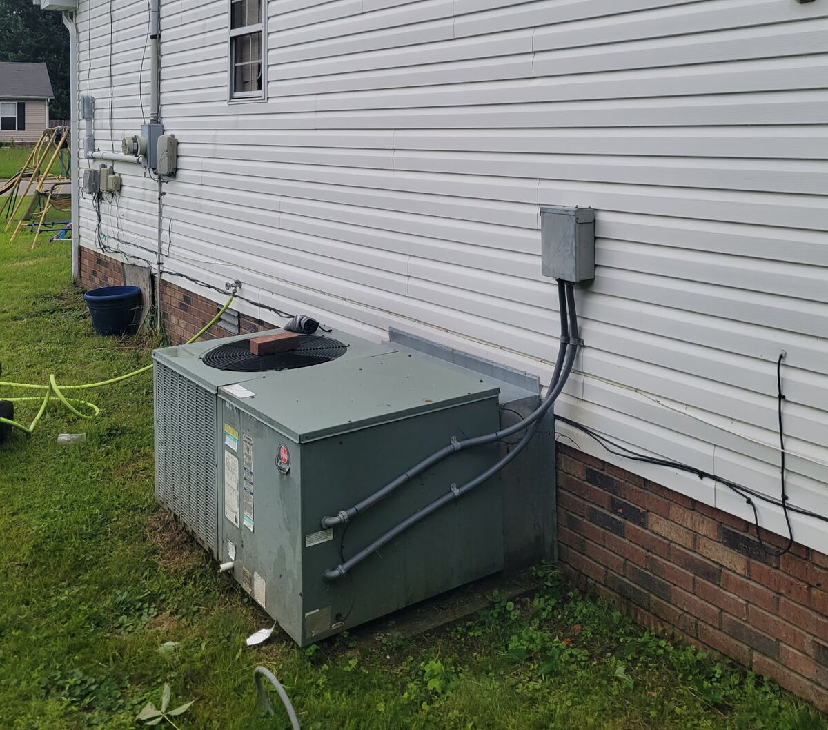 Same house after Power Pals soft washing — clean white siding